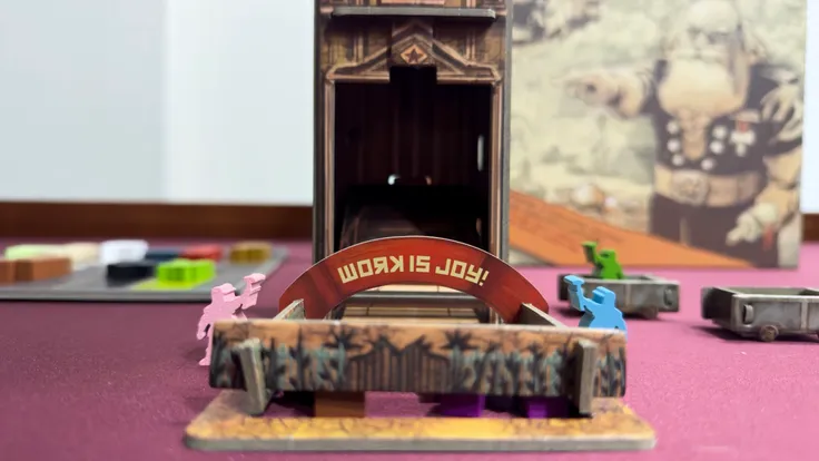 Image of the Bureaucracy Tower with a banner that states 'Work is joy!'