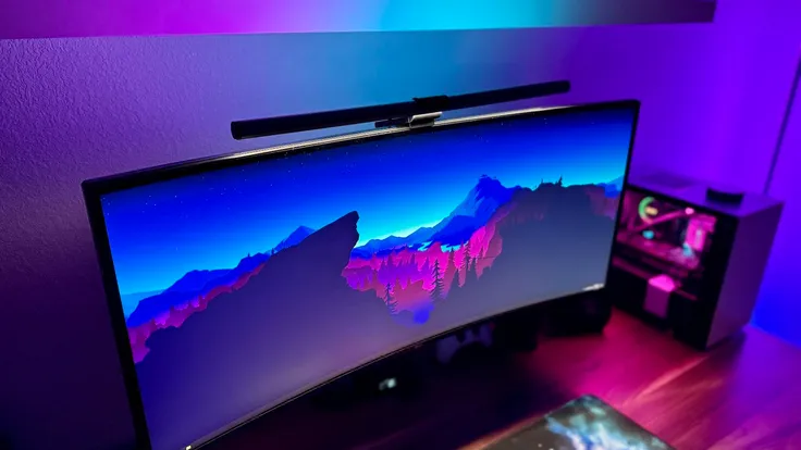 Quntis RGB Pro on an ultrawide monitor next to a gaming desktop PC. Quntis RGB Pro on an ultrawide monitor next to a gaming desktop PC.